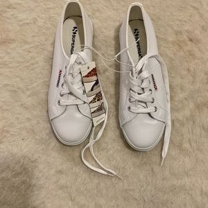 Brand new Superga white leather sneakers.Never worn tags on.Fits like size 9 US.